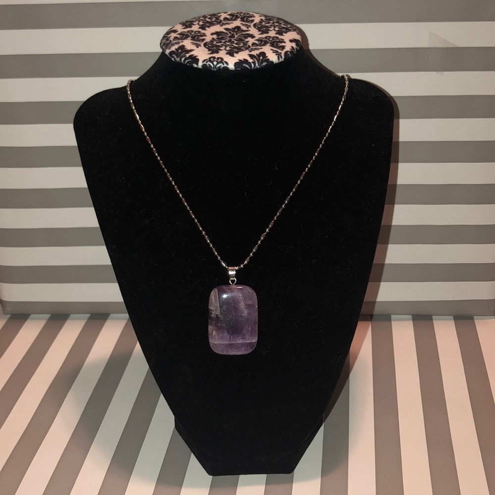 Amethyst Quartz with a stainless steel necklace.